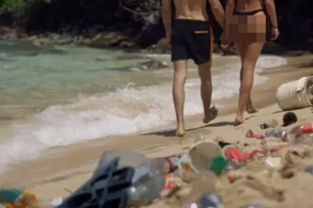 Pornhub 'Dirtiest Porn Ever': couple walking along a beach covered in rubbish 