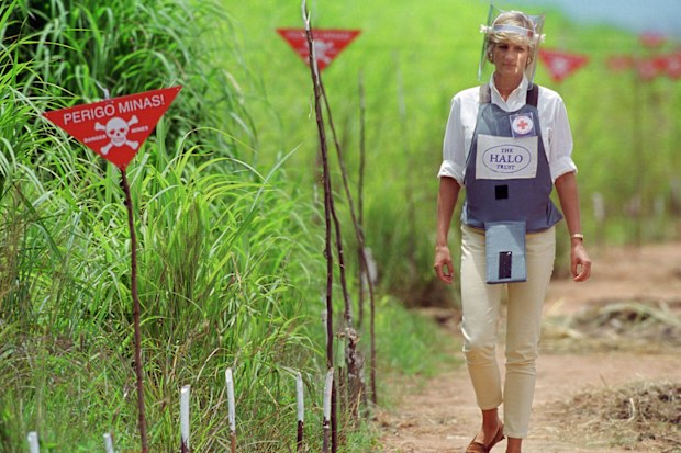 Princess Diana walks through a cleared landmine field in Angola, 1997.