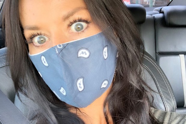 Madeleine West wearing a face mask