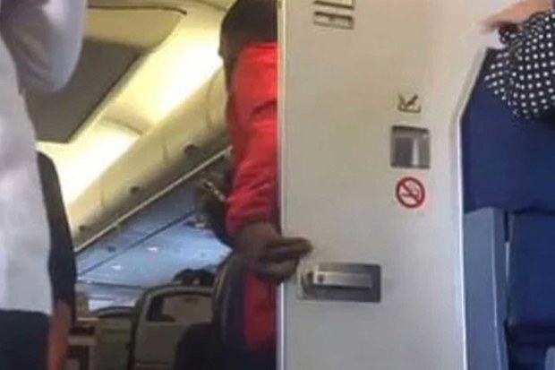 Man emerges from plane bathroom, joins mile high club