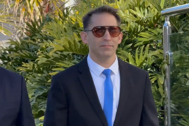 In a video screenshot, Former Royal Australian Air Force pilot Robert John Crawford (right) arrives at Toowoomba Magistrates Court in Toowoomba, Monday, August 18, 2025.