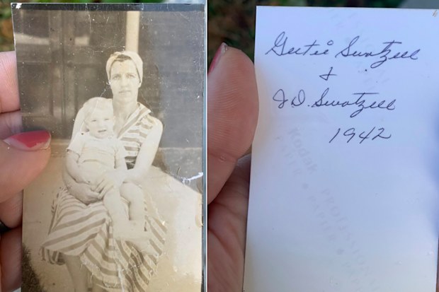 Woman holding photo blown away in tornado