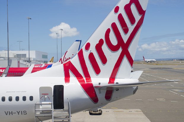 "Sydney, NSW, Australia - December 12, 2012: Virgin Australia plane with stairs waiting for passengers to board at Sydney Airport"