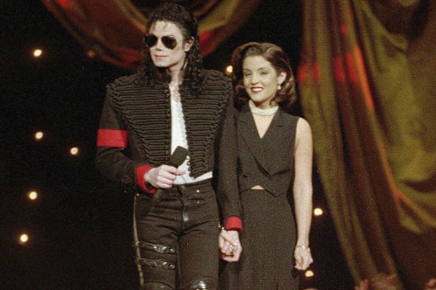 Michael Jackson and Lisa Marie Presley-Jackson acknowledge applause from the audience after coming out onstage to open the 11th annual MTV Video Music Awards at New York's Radio City Music Hall, Sept. 8, 1994