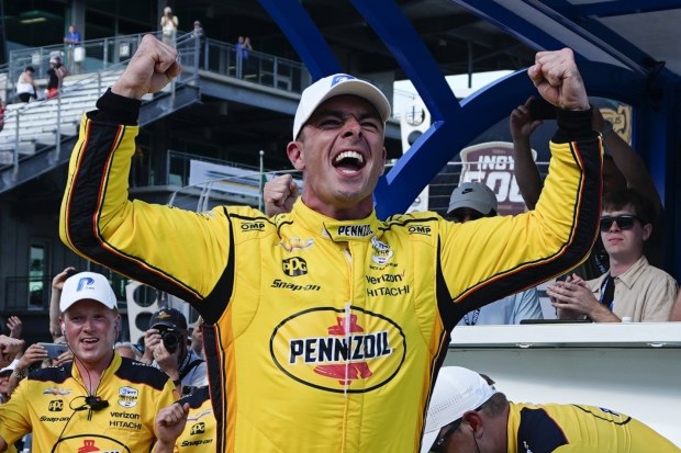Scott McLaughlin celebrates winning pole position for the 108th Indianapolis 500.