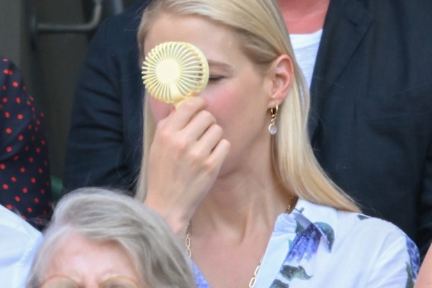 Lady Gabriella Kingston uses a handheld fan at the Wimbledon Tennis Championships at the All England Lawn Tennis and Croquet Club on June 30, 2025 in London, England. 