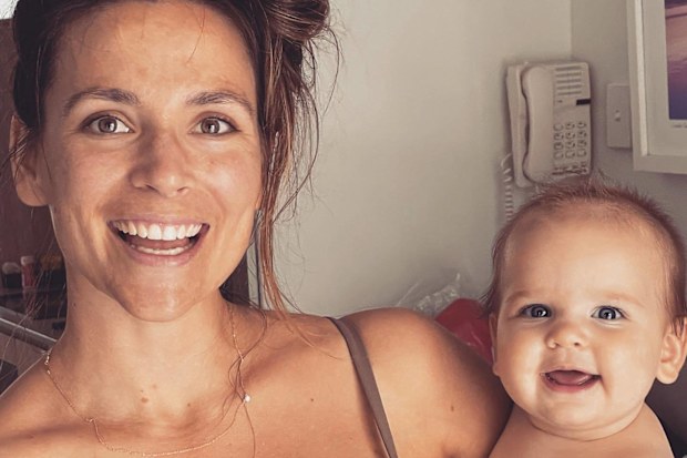 Rachael Calvert wearing a Marvell Lane bikini with her first child, Murphy.