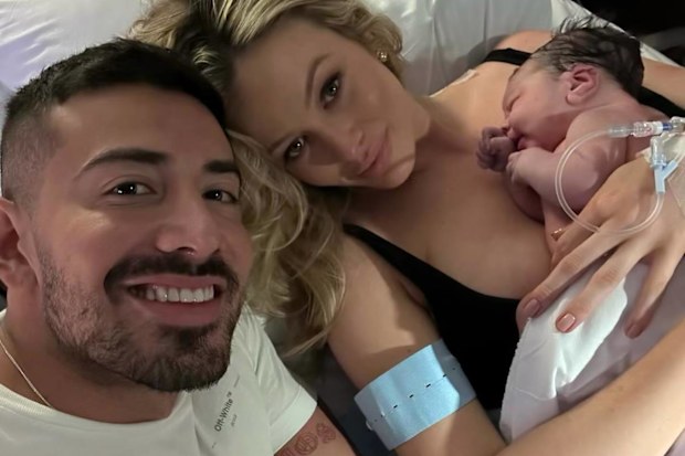 Simone Hotlznagel and Jono Castano with their daughter Gia.