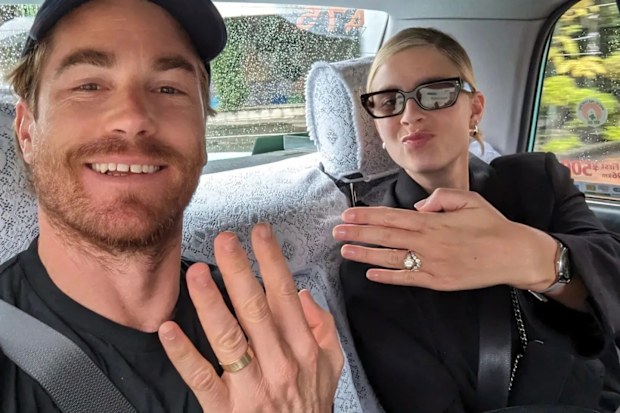 Hayden Quinn with wife Jax showing off their wedding rings.