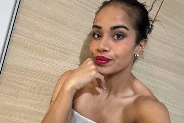 Matildas forward Mary Fowler poses in red lipstick.