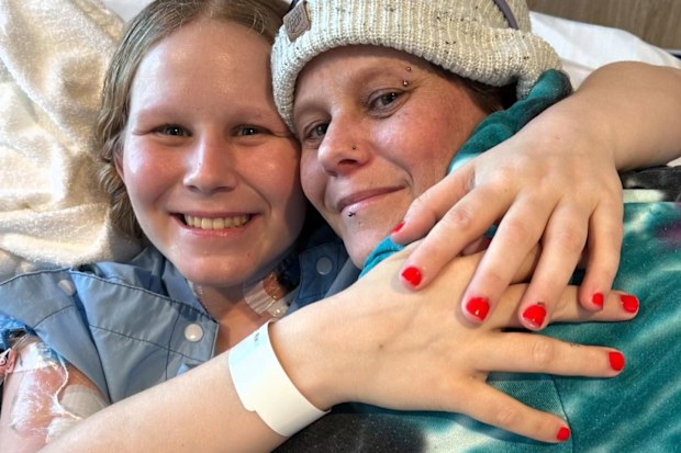 Ambar Powell in hospital after complications from her endometriosis surgery.