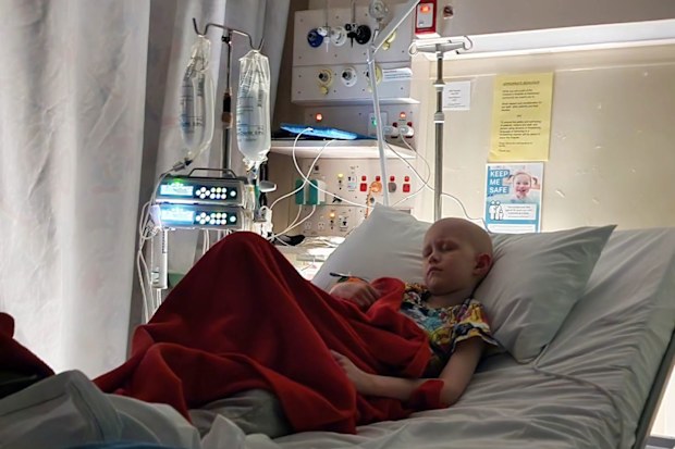Ollie Jepson in hospital during cancer treatment.