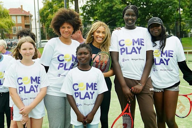 Ayan Broomfield with young tennis players in Australia during an event encouraging kids in sport.