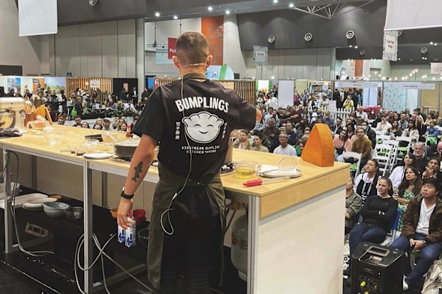 Brendan Pang cooking in front of a live audience.