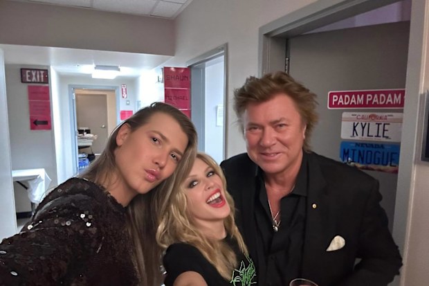 Richard and Christian Wilkins pose in Las Vegas with Kylie Minogue.