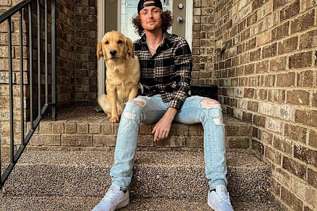 Bailey Zimmerman with his dog, Marley.