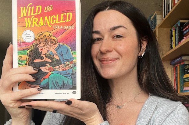 Lyla Sage shows off the fourth book in her Rebel Blue Ranch series, Wild and Wrangled.