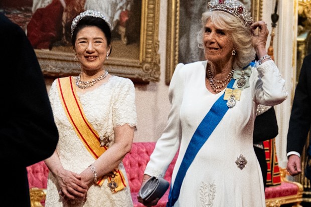 LONDON, ENGLAND - JUNE 25: Queen Camilla and Empress Masako make their way along the East Gallery to attend the State Banquet for Emperor Naruhito and his wife Empress Masako of Japan at Buckingham Palace on June 25, 2024 in London, England. The Japanese royal couple arrived in Britain for a three-day state visit hosted by King Charles III. (Photo by Aaron Chown - WPA Pool/Getty Images)