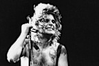 FILE - Ozzy Osbourne, left, performs, Jan. 17, 1985, at the Rock in Rio music festival in Rio de Janeiro, Brazil. (AP Photo, File)