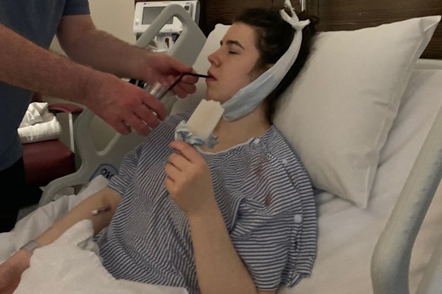 Saskia Rogers in hospital after surgery for her oral cancer.