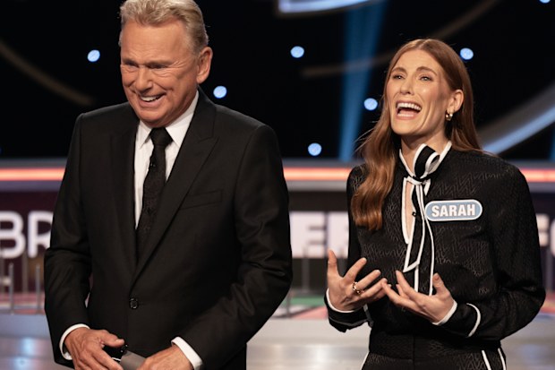 Wheel of Fortune US host Pat Sajak with celebrity guest Sarah Levy 