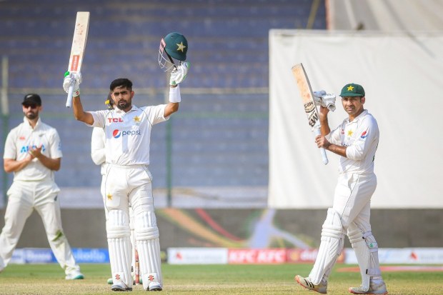 Babar Azam raises his bat after scoring another century for Pakistan.
