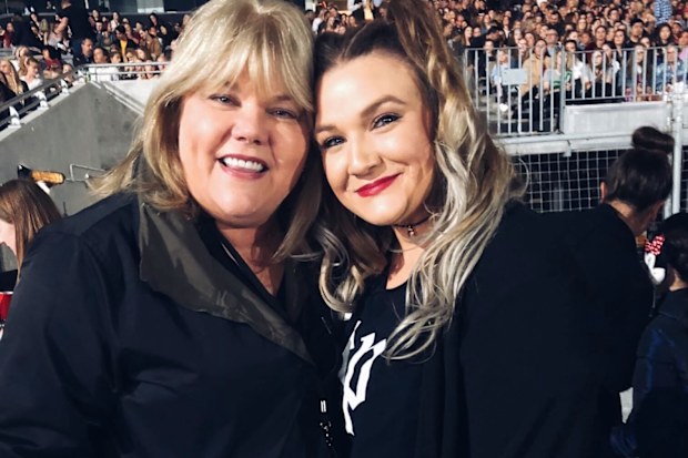 Carly Heading poses with Taylor Swift's mother Andrea at one of her Reputation shows in 2018.