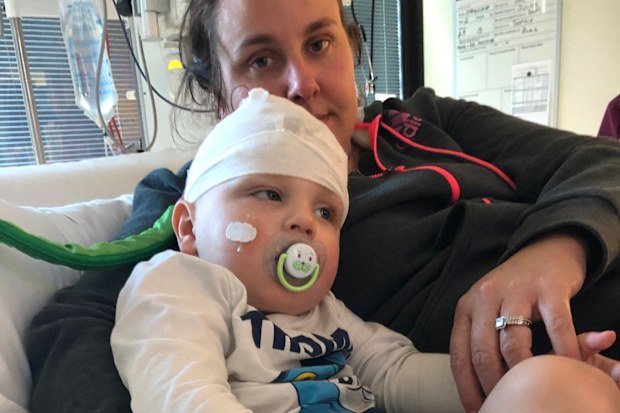 Spencer McPherson with his mum in hospital.