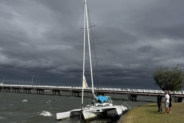 Yachts dragged to rocky shoreline Bribie Island Cyclone Alfred
