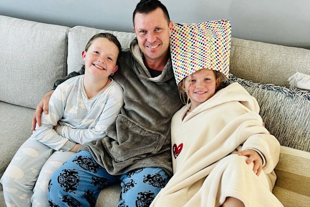 Charli Gerrey with her dad and little sister during cancer treatment.