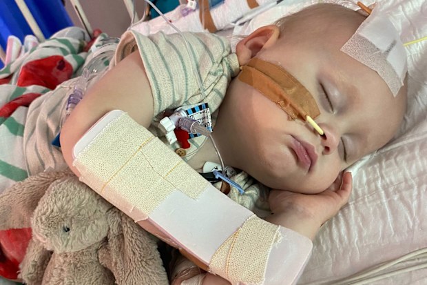 Noah in hospital receiving treatment for his rare condition.
