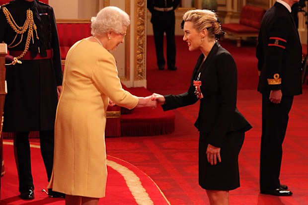 Actress Kate Winslet is awarded a CBE, for services to drama by Queen Elizabeth II during an Investiture ceremony at Buckingham Palace in central London. Date taken: 21-Nov-2012