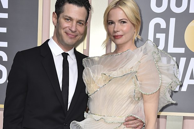 Thomas Kail, left, and Michelle Williams arrive at the 80th annual Golden Globe Awards at the Beverly Hilton Hotel on Tuesday, Jan. 10, 2023