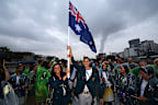 PARIS, FRANCE - JULY 26: (L-R) Jessica Fox and Eddie Ockenden, Flagbearers of Team Australia, pose while cruising on the River Seine during the athletes parade during the opening ceremony of the Olympic Games Paris 2024 on July 26, 2024 in Paris, France. (Photo by Quinn Rooney/Getty Images)