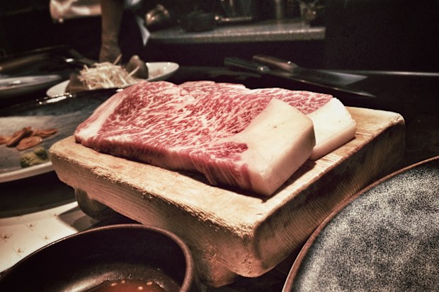 Two fresh cuts of authentic Kobe steak in a restaurant in Kobe, Japan.