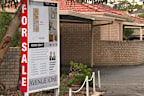 For sale sign at house