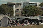 There are families living in the tents with children that still need to go to school and parents with jobs.
