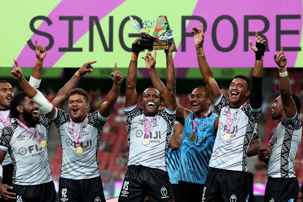Fiji men's sevens team celebrating winning the Singapore Sevens tournament.