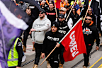 Red, black and blue flags were waved amongst the crowd of demonstrators in Melbourne. 