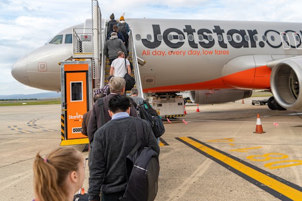 Launceston, Australia: December 11, 2019: Passengers boarding a Jetstar flight from Launceston Airport to Tullamarine Airport in Melbourne, Tasmania, Australia.