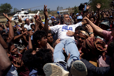 Xanana Gusmao is held aloft by crowds, 2001