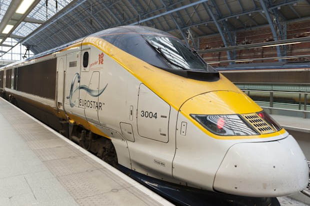 Eurostar train at platform of St Pancras International railway terminus.