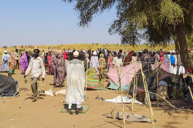 Sudanese who fled el-Fasher city, after Sudan's paramilitary forces killed hundreds of people in the western Darfur region, gather at their camp in Tawila, Sudan, Wednesday, Oct. 29, 2025.
