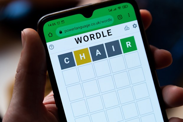 A man plays with the word game Wordle 