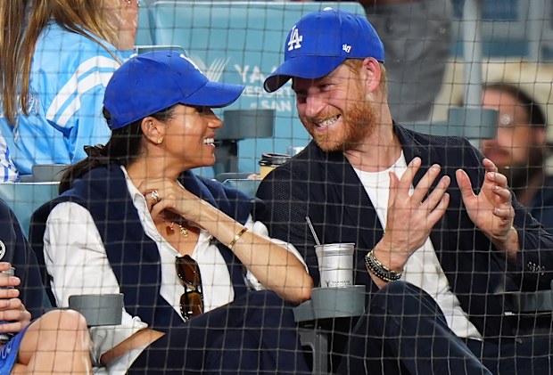 Prince Harry and Meghan Markle, the Duke and Duchess of Sussex, at Game 4 of baseball's World Series between the Los Angeles Dodgers and the Toronto Blue Jays in Los Angeles, Tuesday, Oct. 28, 2025. 