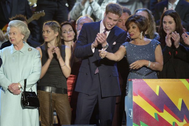 Ozzy Osbourne on stage with Queen Elizabeth II and Prince William chats to Shirley Bassey on stage in the gardens of Buckingham Palace, after the second concert to commemorate the Golden Jubilee of Britain's Queen Elizabeth II, June 3 2002.