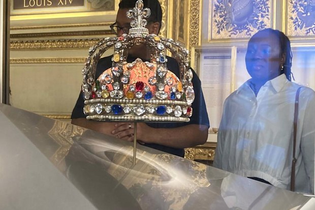 People check jewelry in the Apollo Gallery of the Louvre museum on Sept. 4, 2025 in Paris.