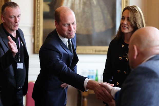 Britain's Prince William and Kate, Princess of Wales, meet volunteers and operational staff who were involved in facilitating the Committal Service for Queen Elizabeth II at St George's Chapel, at Windsor Guildhall, Berkshire, Thursday, Sept. 22, 2022. (Ian Vogler/Pool Photo via AP)