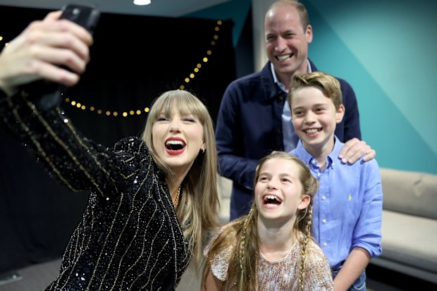 Taylor Swift takes a selfie with Prince William, Prince George and Princess Charlotte at Wembley Stadium, London