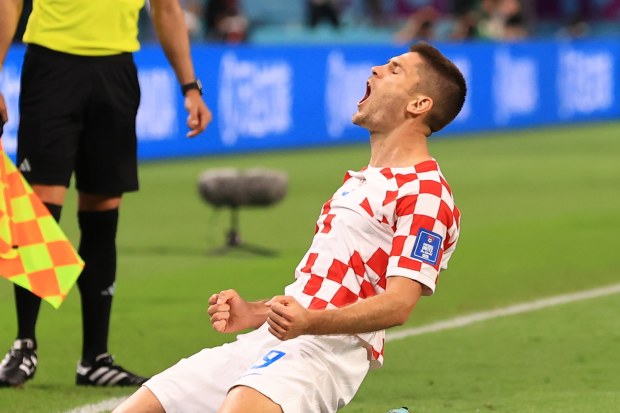 DOHA, QATAR - NOVEMBER 27: Andrej Kramaric #9 of Croatia celebrates after scoring a goal during the Qatar 2022 World Cup Group F football match between Croatia and Canada at the Khalifa International Stadium in Doha on November 27, 2022. (Photo by Serhat Cagdas/Anadolu Agency via Getty Images)